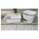 White enamelware items with black trim, including