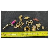 Gold tone brooches in lapels some rhinestone