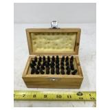 Letter and number steel punch set in wooden box.