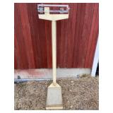 Detecto stand on scale.