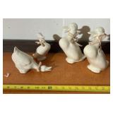 white ceramic or porcelain duck figurines