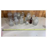 Collection of vintage glass bottles, including