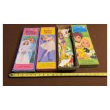 collection of vintage paper doll sets,