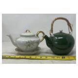 vintage teapot is a porcelain piece with floral,