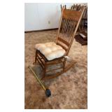 Wooden rocking chair featuring a woven cane seat