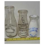 Old milk bottles Howard Tebay  Quality Dairy