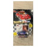 NASCAR stock car with collectors card and display