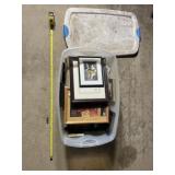 Plastic tote full of picture frames