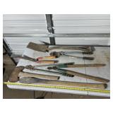 yard and garden tools, including an axe, hedge