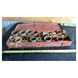 Socket set housed in a red metal carrying