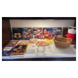 Recipe cookbooks, wicker basket, cutting board,