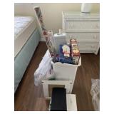 Trash can with Christmas bows and paper, gift