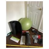 Exercise ball, mat and work out supplies.