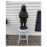 White step stool and resin boy with bird bath.