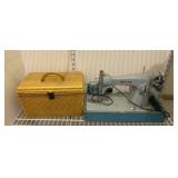 White sewing machine and sewing box full of