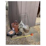 Bucket stool, bucket with sand and planters.