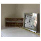 Glass clock and wood sign.