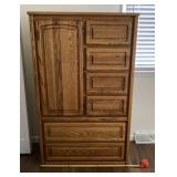 Solid wood oak armoire with drawers measures 38