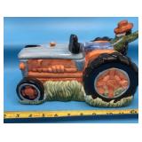 Ceramic cookie jar featuring a farmer riding a