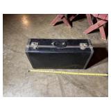 Black hard-shell suitcase.