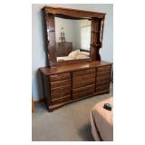 wooden dresser with a matching hutch mirror