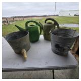 Metal buckets,  watering cans