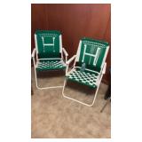 2-folding lawn chairs feature a distinctive green