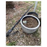 Two flower pots and trellis.