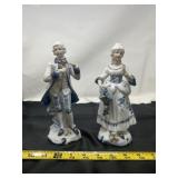 figurines depict a colonial-style courting couple
