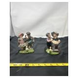 figurines depict scenes of children, styled