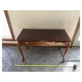 mahogany writing desk styled in the Queen Anne or