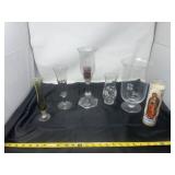 vintage glassware items and a devotional candle,
