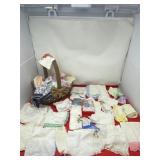 Basket with embroidery and lace handkerchiefs. .