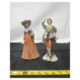 porcelain figurines depicting a colonial couple,
