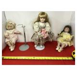 Porcelain dolls with two stands.