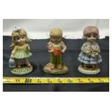 porcelain figurines appear to be "Hummell-like"