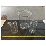 Glass pitchers and plastic bunch container