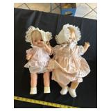two vintage dolls dressed in delicate