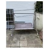 Outdoor swing. It has cushions that arenï¿½t shown