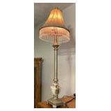 Hollywood Regency style featuring marble and gold