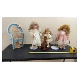 Porcelain dolls with rocking horse, stand wicker