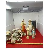 Chalk art religious figurines, artificial flowers