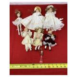 Porcelain dolls and doll Christmas ornaments.