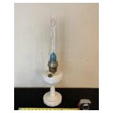 Aladdin kerosene lamp with glass shade.