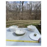 Corning Ware dishes with four lids.