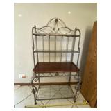 Bakers rack with glass shelves.