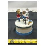 collectible item featuring skating children,