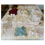 Curtains and doileys on bed