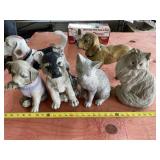 Resin dog and cat statues.