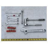 assorted hand tools, including an adjustable